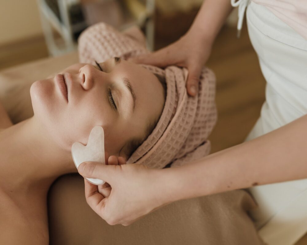 Woman receiving facial treatment